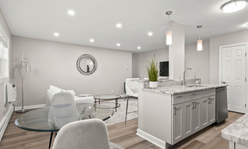 a kitchen with a dining table and chairs