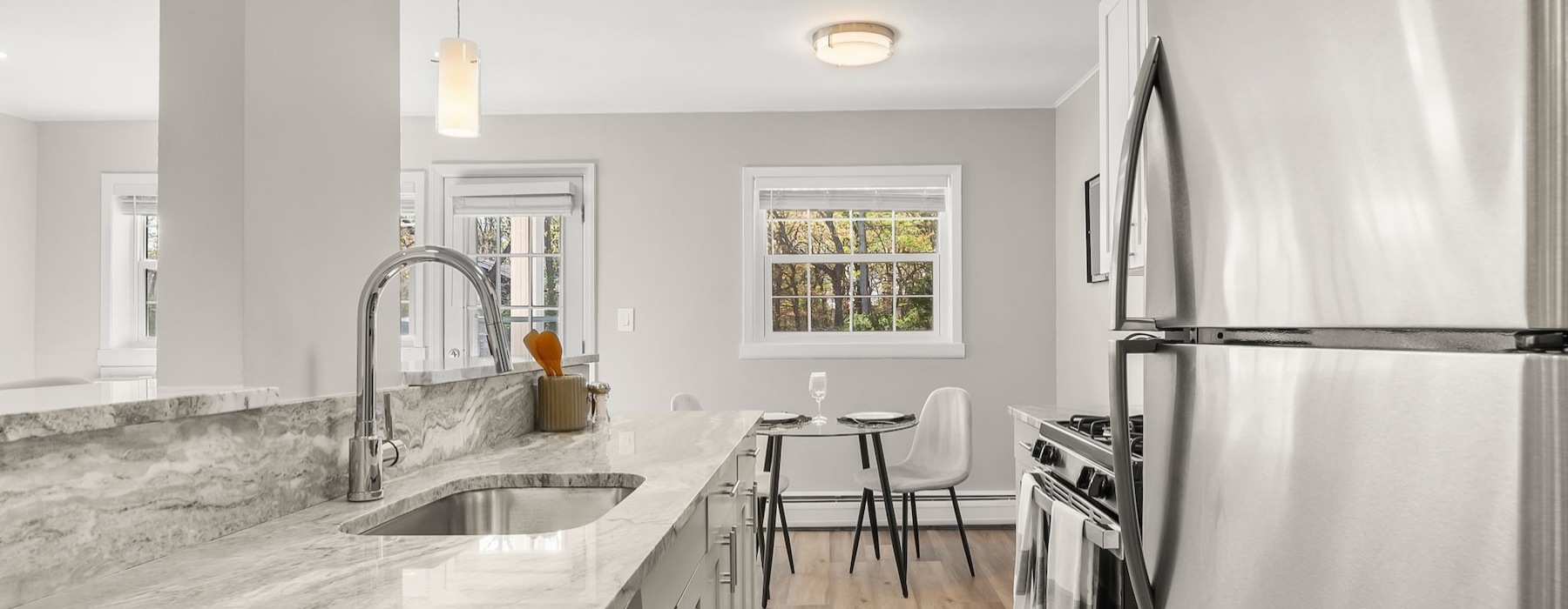a kitchen with marble counters